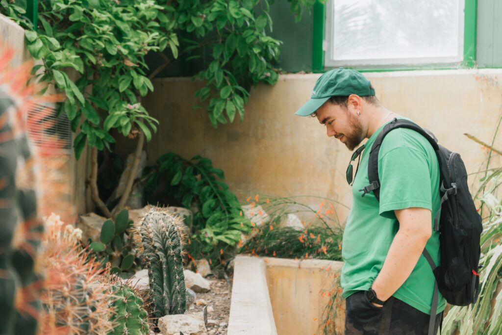 A man is looking with love towards plant
